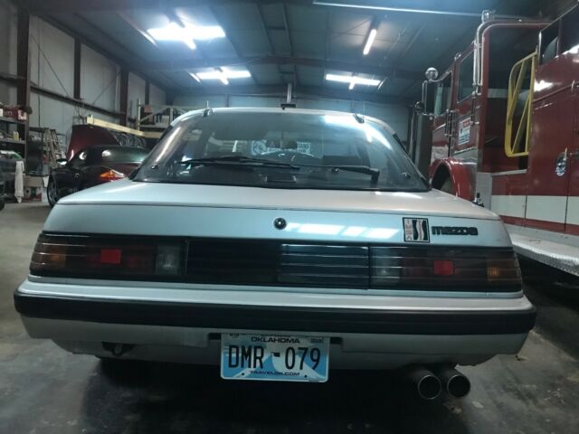 1982 silver gray Mazda RX-7 coupe