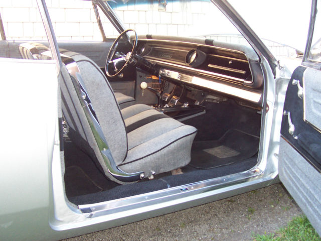 1965 metlic sliver Chevrolet Impala Coupe