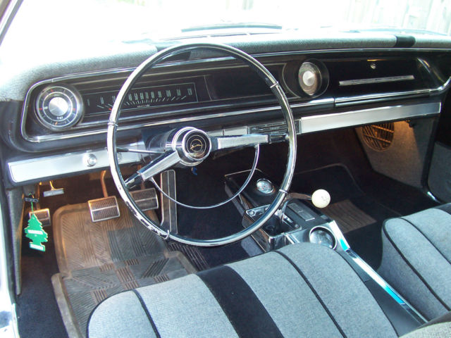 1965 metlic sliver Chevrolet Impala Coupe