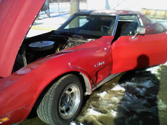 1975 red Chevrolet Corvette coupe