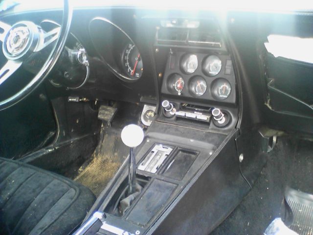 1975 red Chevrolet Corvette coupe