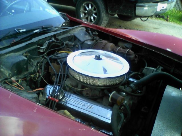 1975 red Chevrolet Corvette coupe