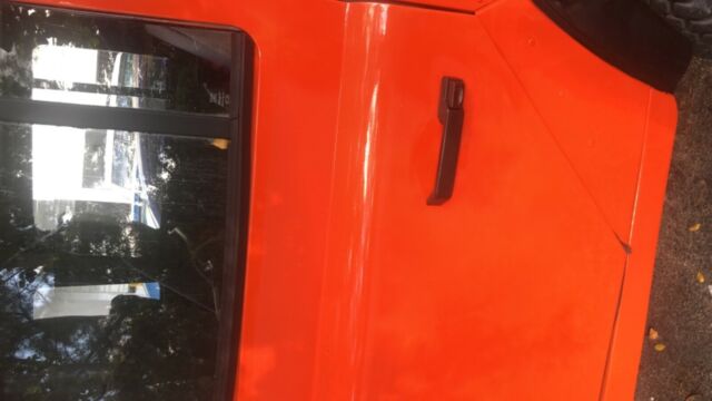 1984 orange Land Rover Defender