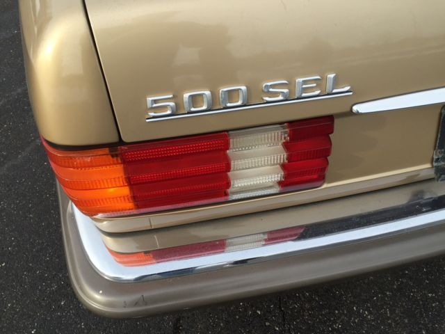 1985 Gold Mercedes-Benz 500-Series