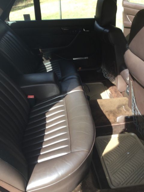 1987 gold Mercedes-Benz 500-Series SEDAN