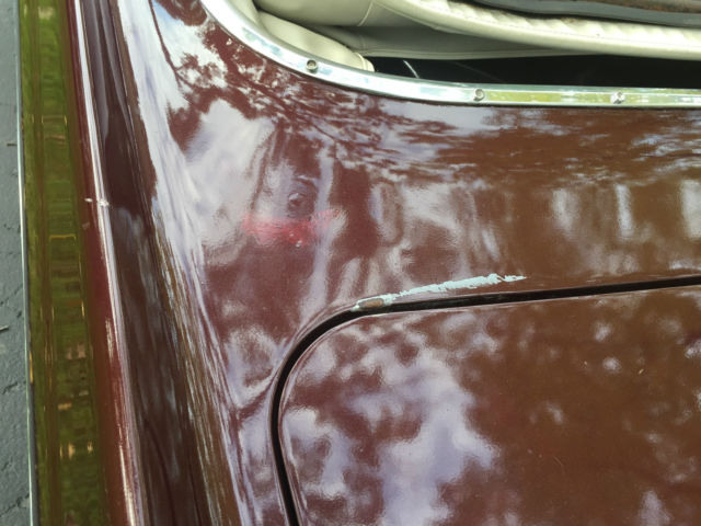 1964 Maroon Cadillac DeVille Convertible