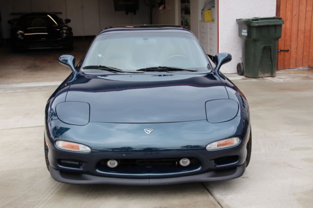 1994 blue Mazda RX-7 Coupe