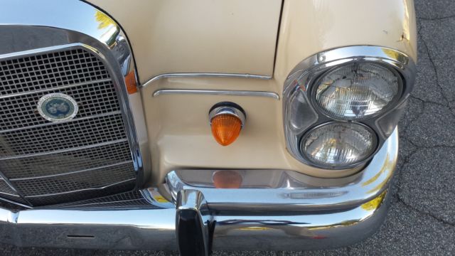 1965 Cream Mercedes-Benz 200-Series Sedan