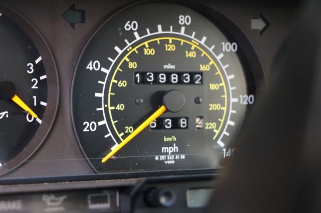 1987 gold  Mercedes-Benz 190-Series 4 door