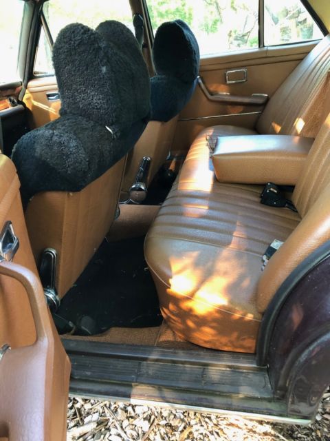 1973 maroon Mercedes-Benz 200-Series Sedan