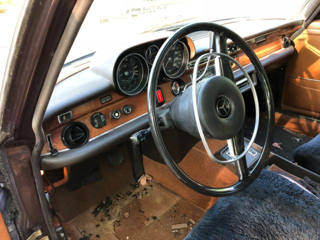 1973 maroon Mercedes-Benz 200-Series Sedan