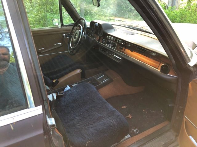 1973 maroon Mercedes-Benz 200-Series Sedan