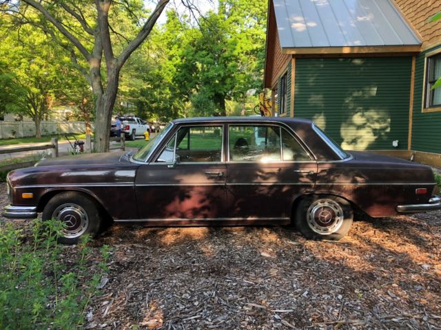1973 maroon Mercedes-Benz 200-Series Sedan