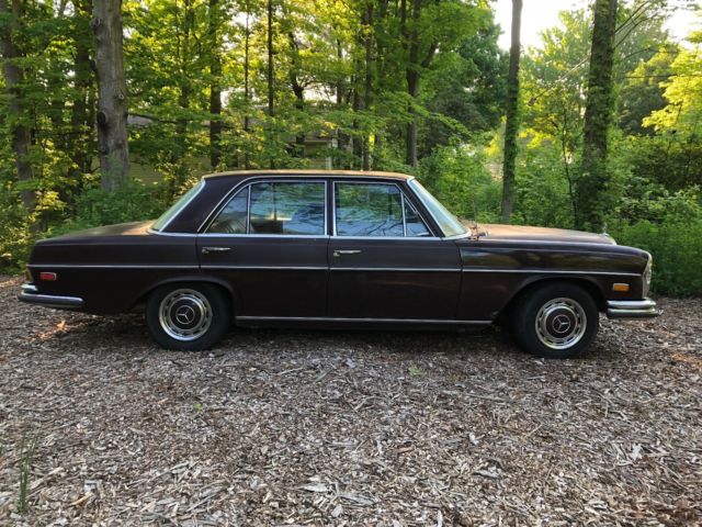 1973 maroon Mercedes-Benz 200-Series Sedan
