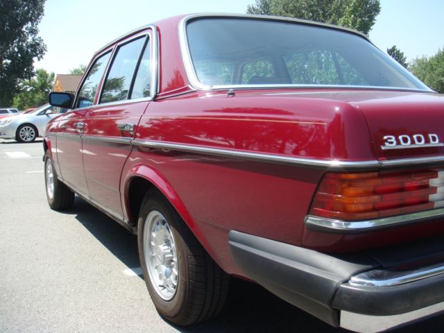 1985 Burgundy Mercedes-Benz 300-Series Sedan