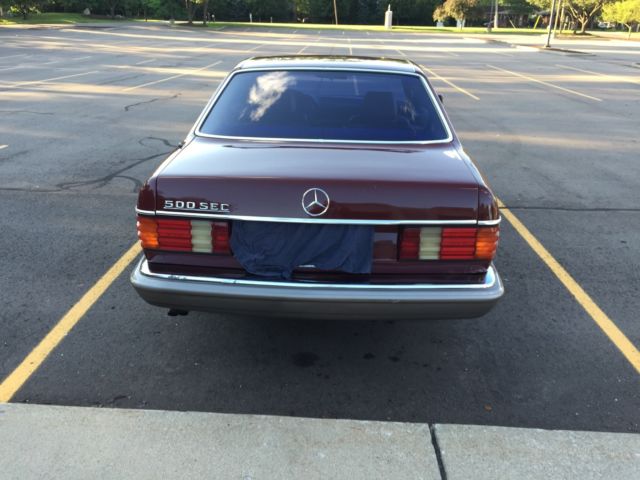 1984 Burgandy Mercedes-Benz 500-Series Coupe