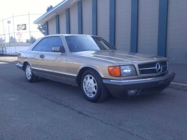 1984 Gold Mercedes-Benz 500-Series Coupe