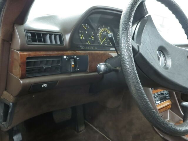 1984 Gold Mercedes-Benz 500-Series Coupe