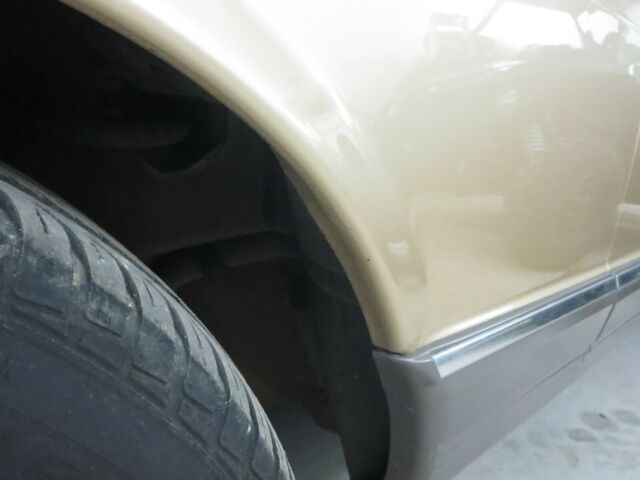 1984 Gold Mercedes-Benz 500-Series Coupe