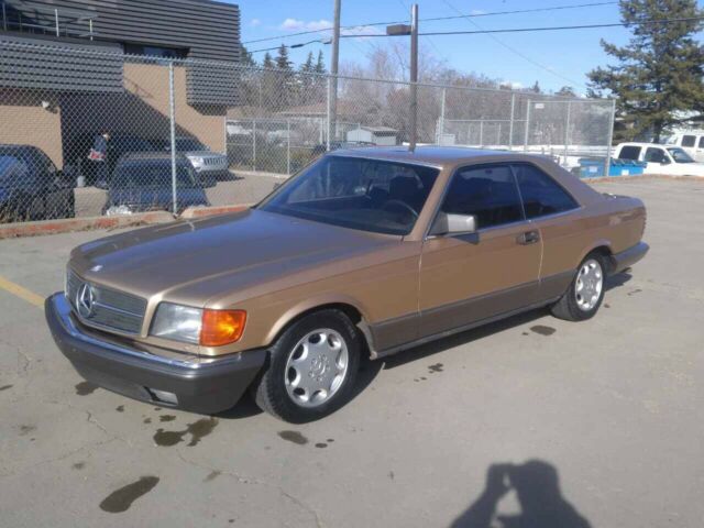 1984 Gold Mercedes-Benz 500-Series Coupe