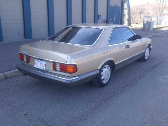 1984 Gold Mercedes-Benz 500-Series Coupe
