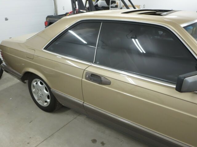 1984 Gold Mercedes-Benz 500-Series Coupe