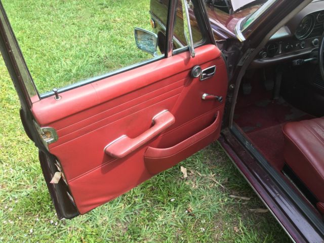 1969 Red Mercedes-Benz 200-Series Sedan