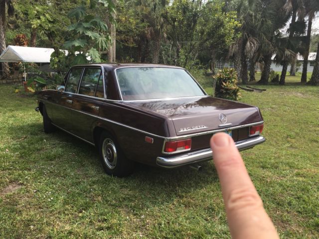 1969 Red Mercedes-Benz 200-Series Sedan