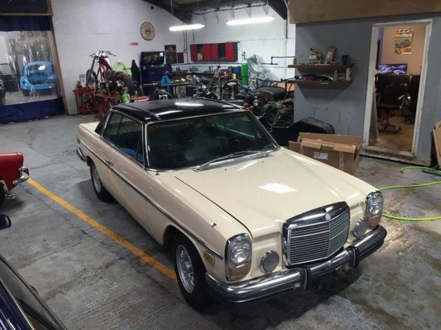 1972 cream and black Mercedes-Benz W114 Coupe