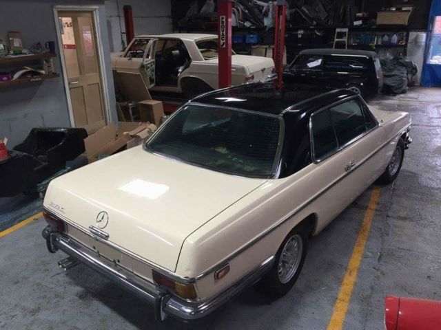 1972 cream and black Mercedes-Benz W114 Coupe
