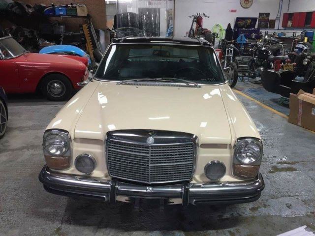 1972 cream and black Mercedes-Benz W114 Coupe