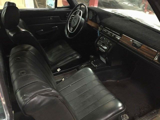 1972 cream and black Mercedes-Benz W114 Coupe