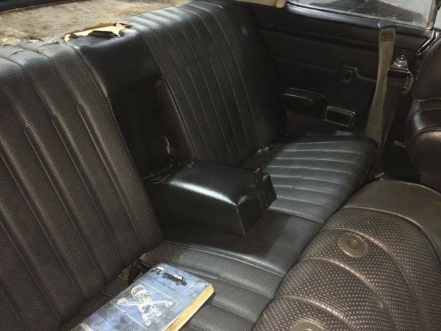 1972 cream and black Mercedes-Benz W114 Coupe