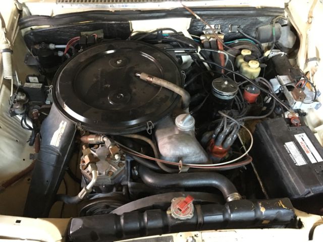 1972 cream and black Mercedes-Benz W114 Coupe