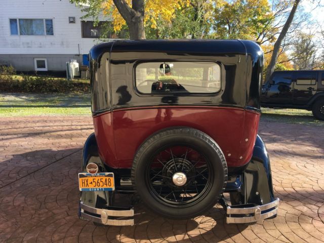 1931 Burgundy Ford Model A four door coupe