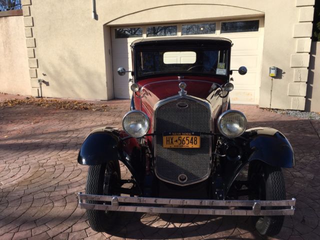 1931 Burgundy Ford Model A four door coupe