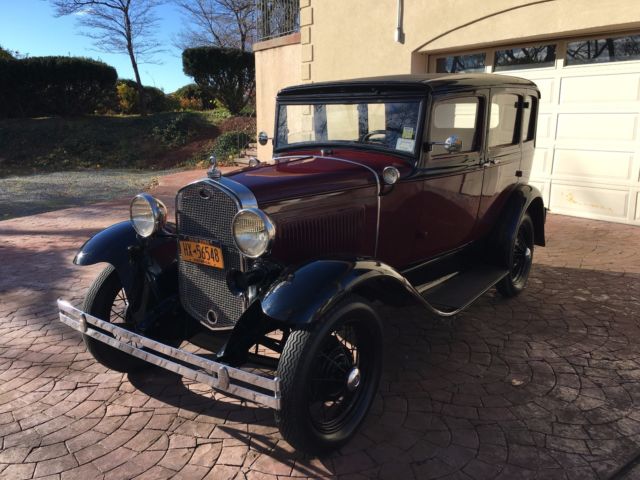 1931 Burgundy Ford Model A four door coupe