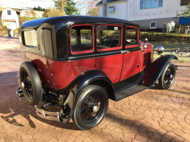1931 Burgundy Ford Model A four door coupe