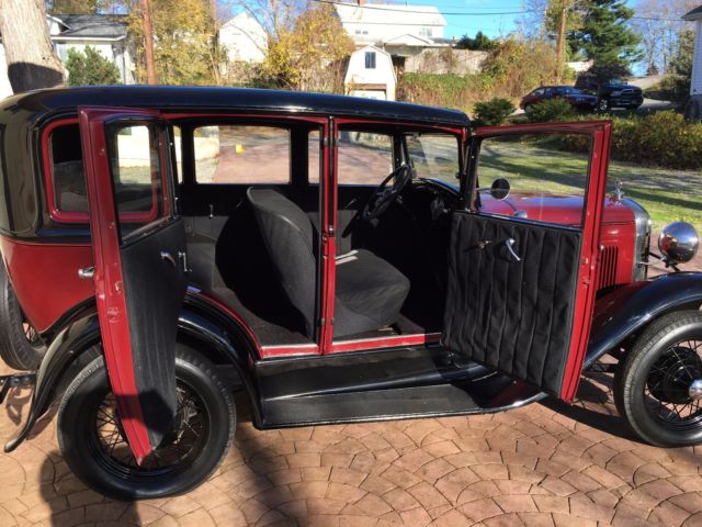 1931 Burgundy Ford Model A four door coupe