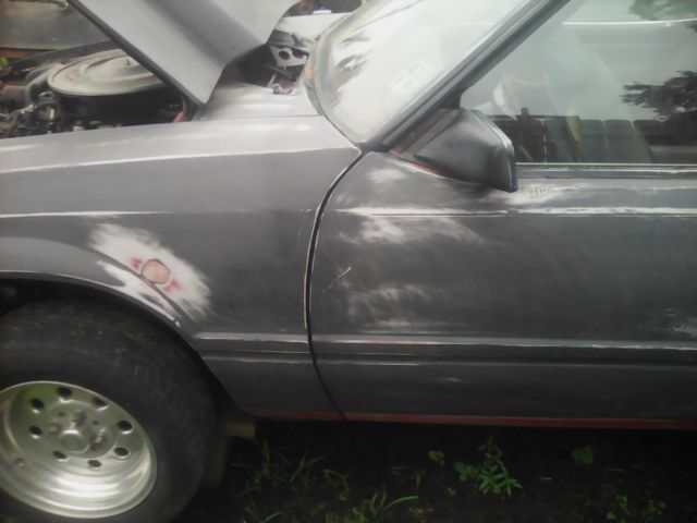 1980 Primer black Ford Mustang Foxbody