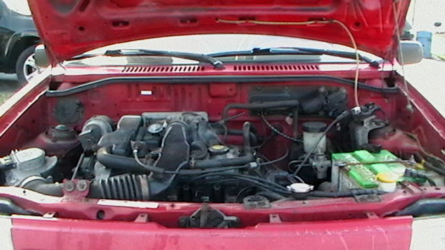 1990 Red Ford Festiva Hatchback