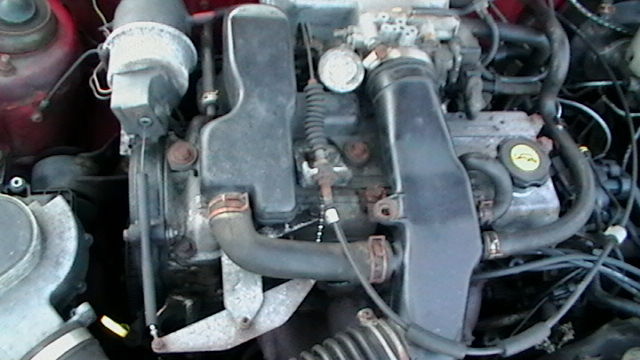 1990 Red Ford Festiva Hatchback