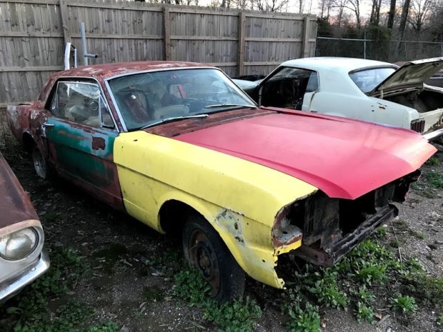 1965 red Ford Mustang Coupe