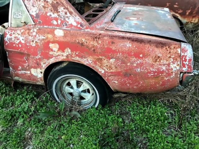 1965 red Ford Mustang Coupe