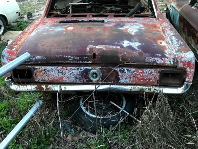 1965 red Ford Mustang Coupe