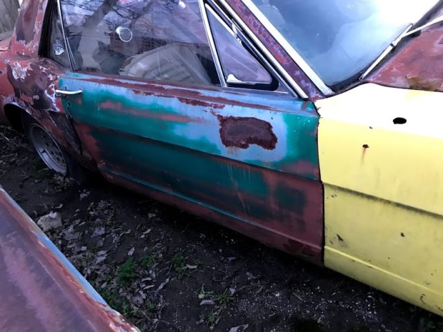 1965 red Ford Mustang Coupe