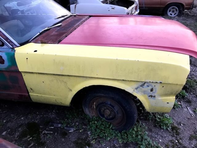 1965 red Ford Mustang Coupe