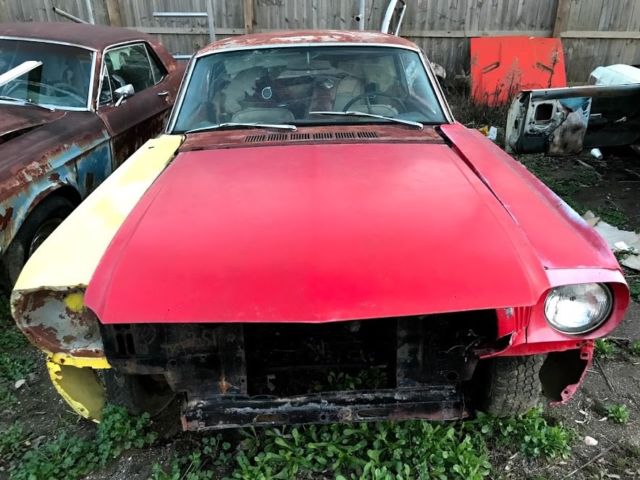 1965 red Ford Mustang Coupe