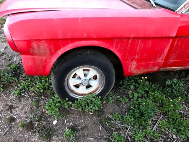 1965 red Ford Mustang Coupe