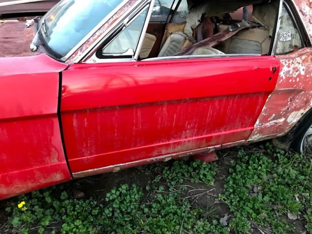 1965 red Ford Mustang Coupe